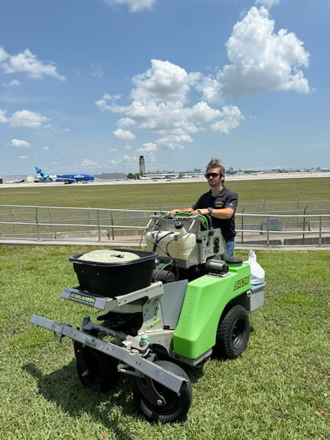 Glade Palm technician treating turf at a commercial property in Broward County